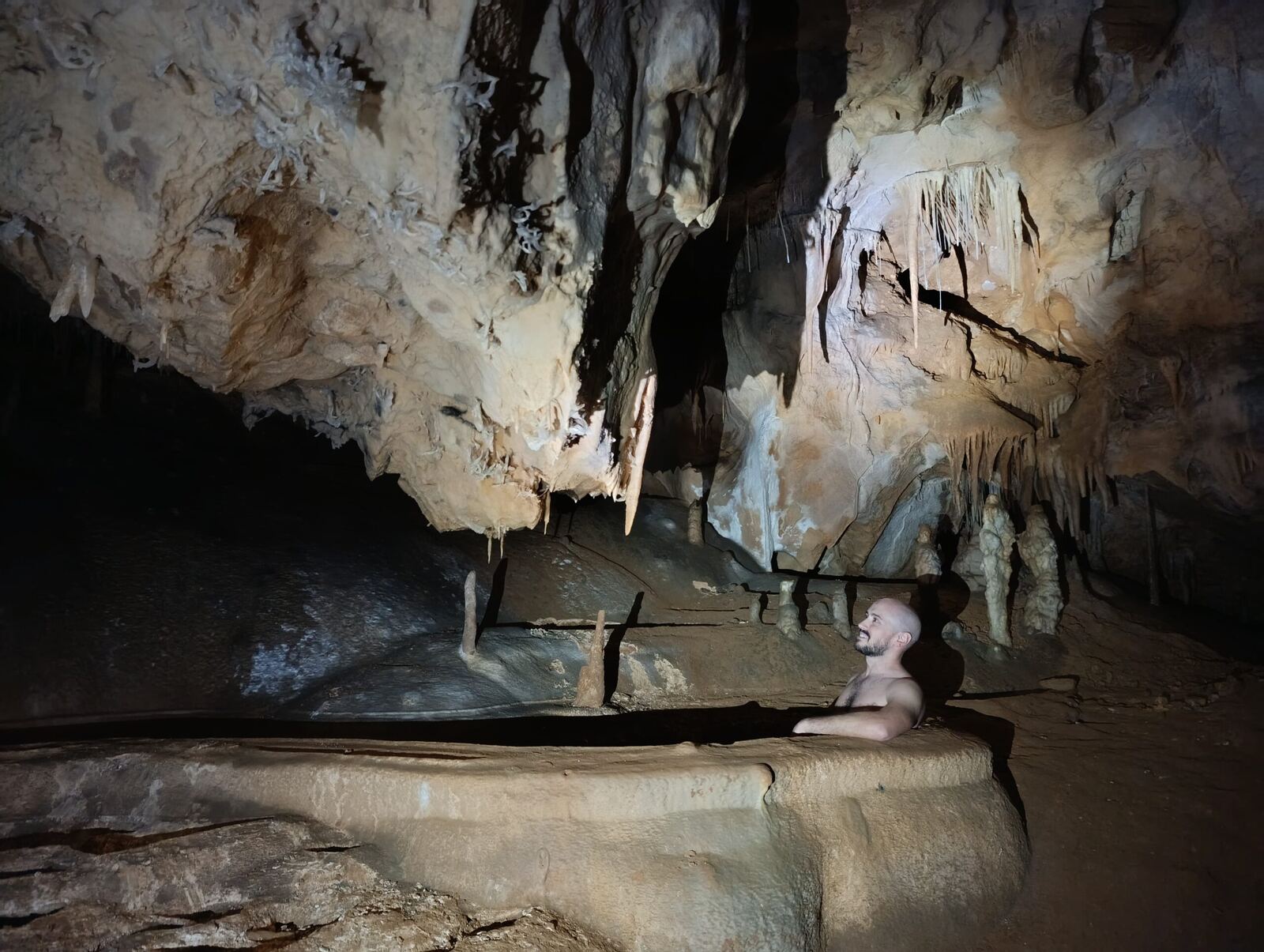 Adrian bathing in a cave