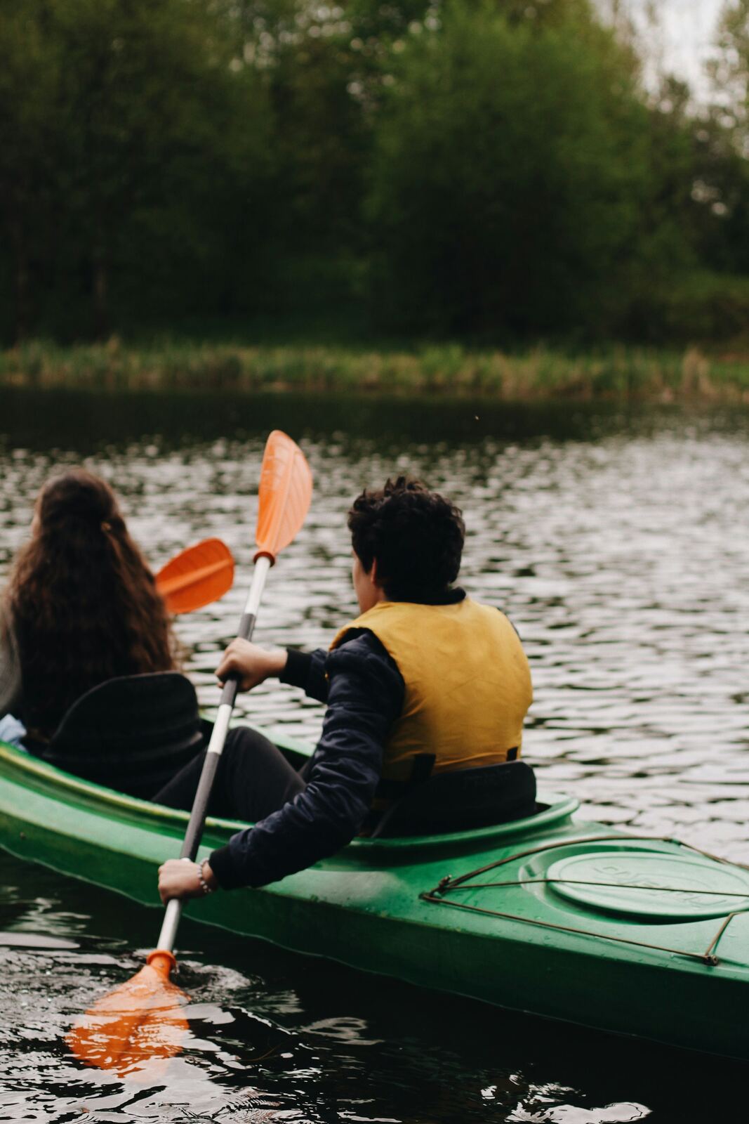Two people kayaking on a river